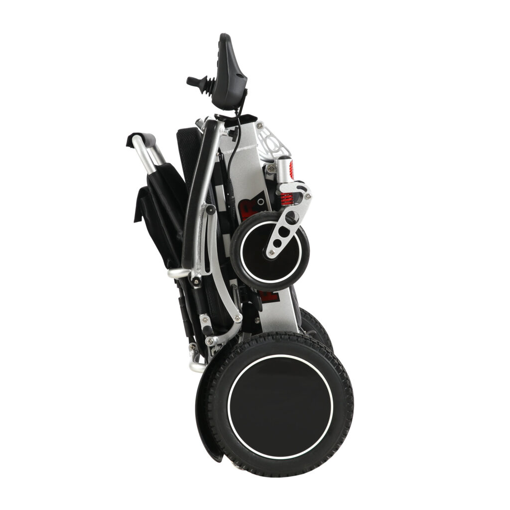Porto Mobility Ranger Maestro XL reclining folding power wheelchair folded and standing upright on its wheels, side view